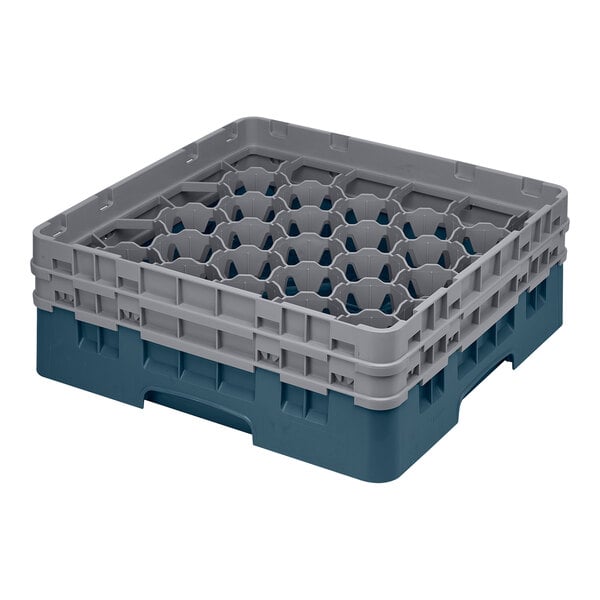 A teal plastic Cambro glass rack with 30 compartments.