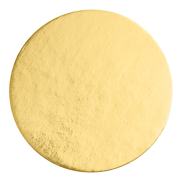 A close up of a gold circle on a white background.