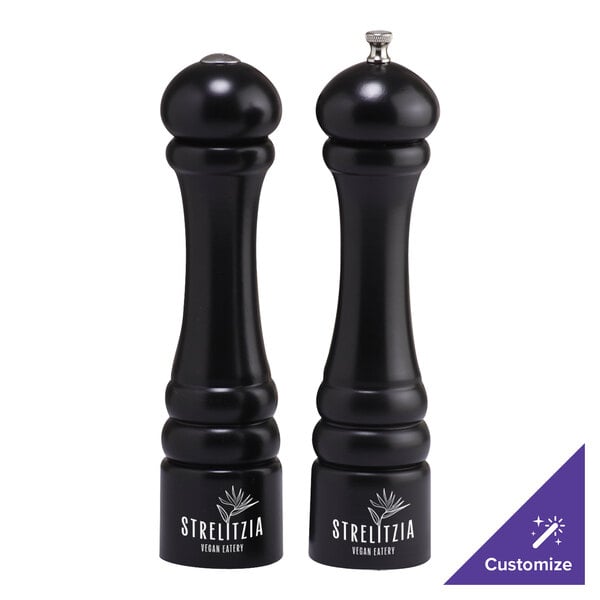A black round Chef Specialties pepper mill with a silver top.