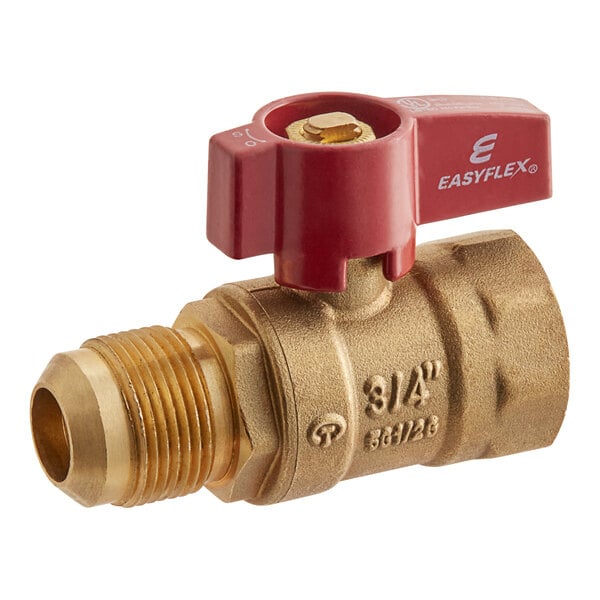 A close-up of a brass Easyflex gas valve with a red handle.