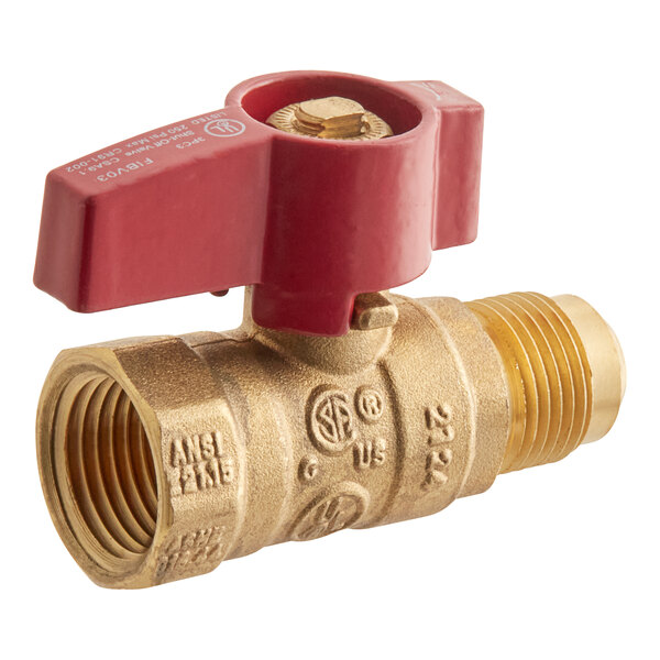 A close-up of a brass Easyflex gas valve with a red handle.