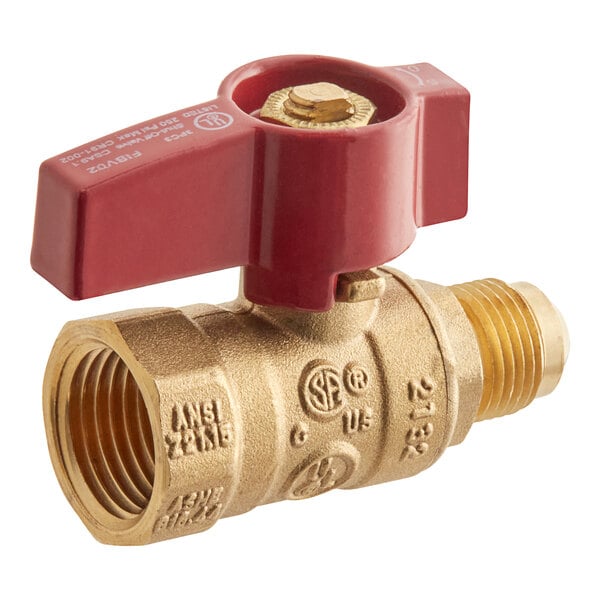 A close-up of a brass Easyflex gas valve with a red handle.