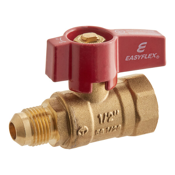 A close-up of a brass Easyflex gas ball valve with a red handle.