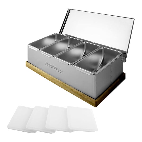 A Pinnacolo stainless steel condiment bar with four compartments on a wood base.