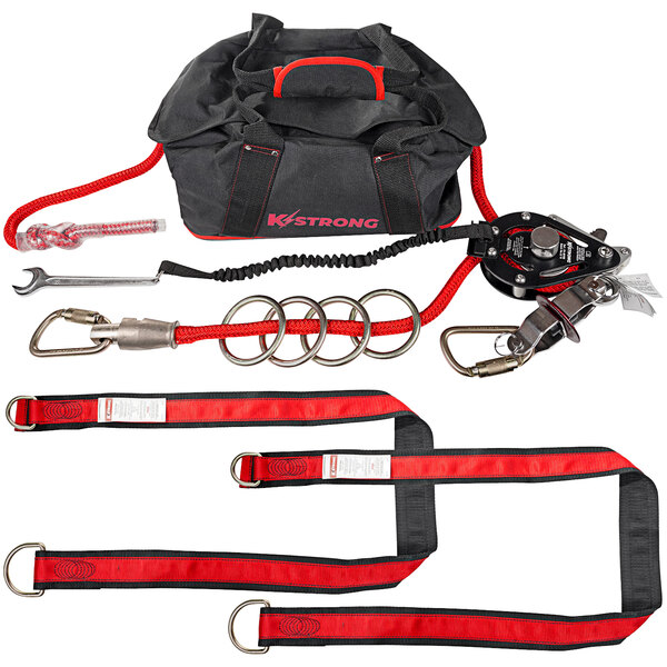 A black and red KStrong duffel bag with a red and black strap inside.