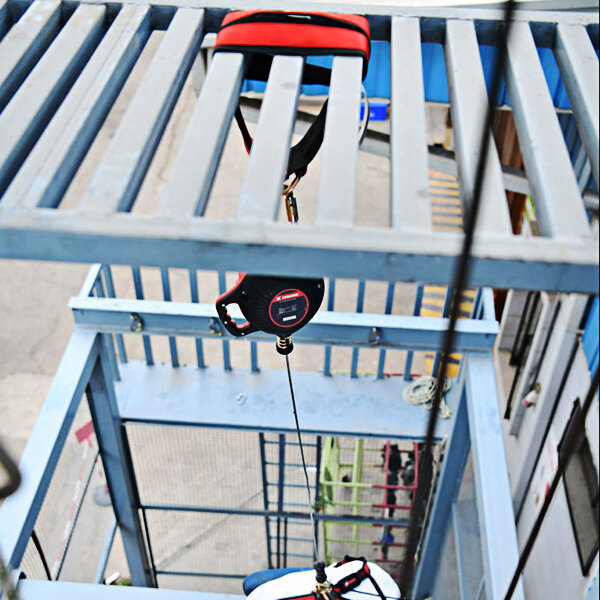 A KStrong choker style anchor strap with a red and black wear pad attached to it.