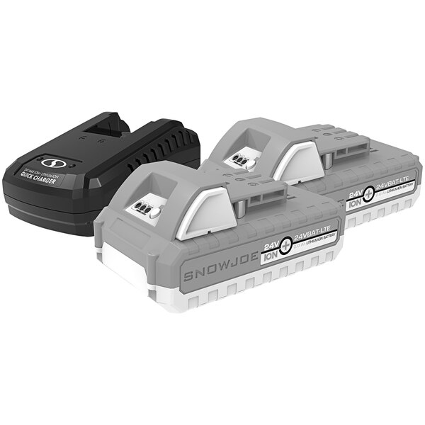 A Snow Joe quick charger next to two 24V batteries.