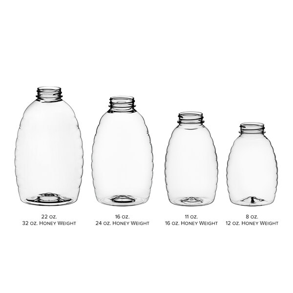 A 22 oz. plastic Classic Queenline PET honey bottle with a black lid.
