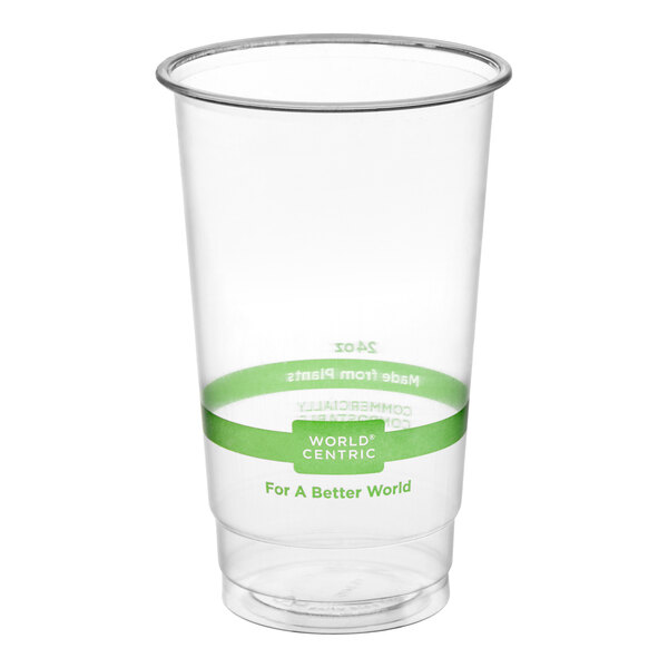 A clear 24 oz. compostable plastic cold cup with a green band and World Centric branding.