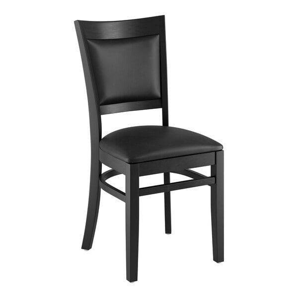 A Lancaster Table & Seating black wood chair with a black cushion.