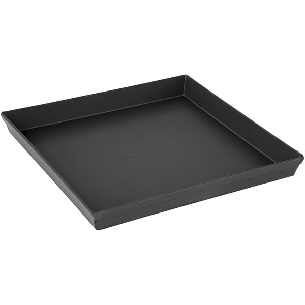 A black LloydPans grandma-style pizza pan on a table.