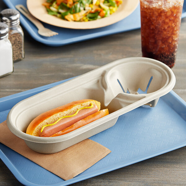 A World Centric compostable fiber tray with a hot dog and a drink on it.