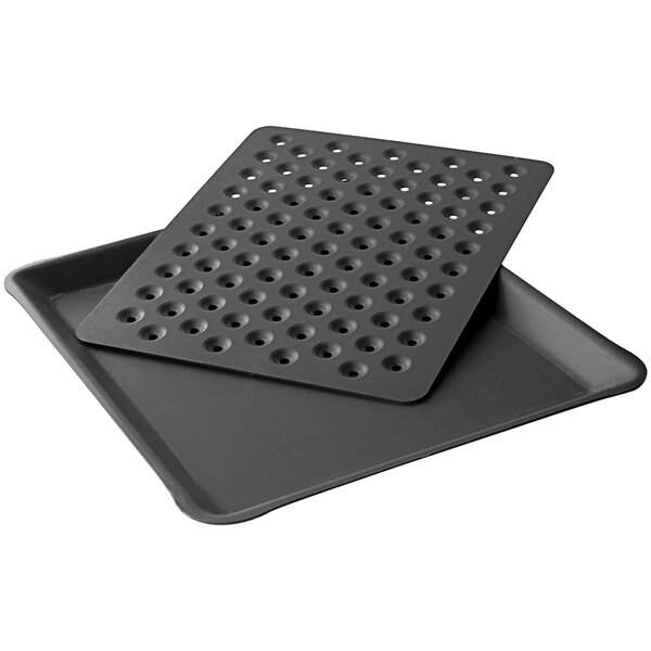 A LloydPans 2-piece appetizer pan set with black trays with holes in them.