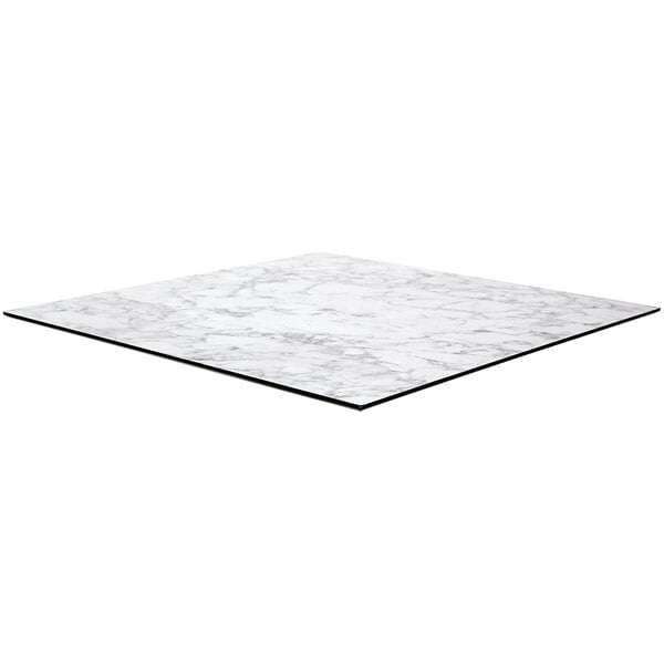 A white marble square table top with black edges.