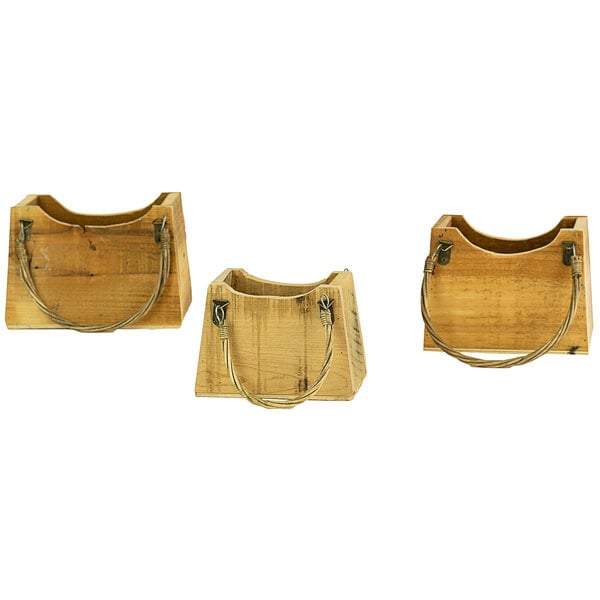 A set of three wooden handbag-shaped planters with metal handles.