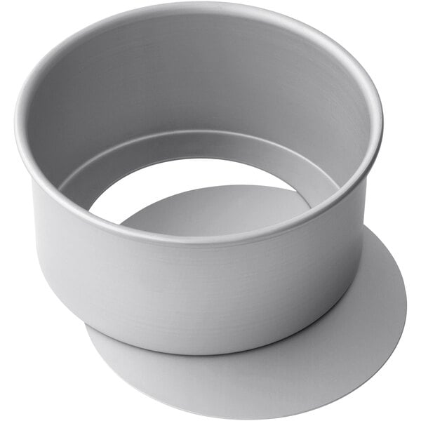 A LloydPans cheesecake pan with a removable bottom and a silver finish.