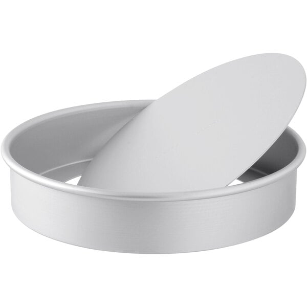 A round white metal LloydPans cheesecake pan with a removable bottom.