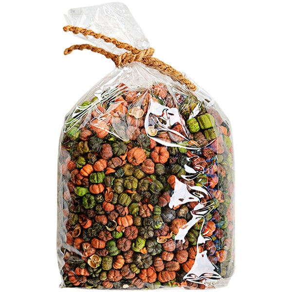 A bag of dried orange and green Putka pods with a rope tied around it.