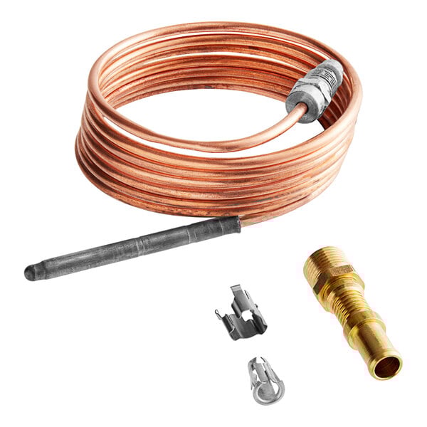 A close-up of a copper wire with brass connectors.