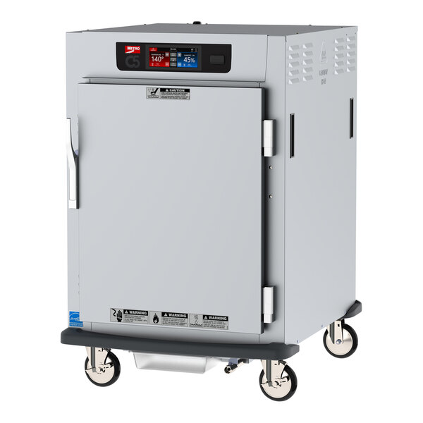 A Metro C5 heated holding / proofing cabinet with a solid door on wheels.