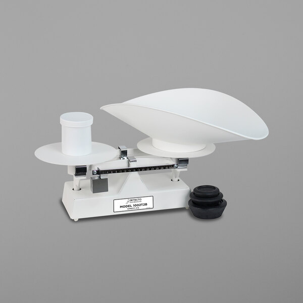A Cardinal Detecto baker's dough scale with a white bowl on it.
