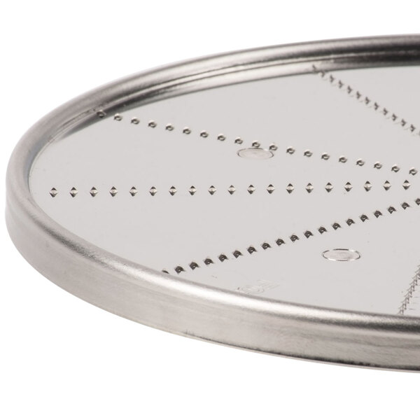 A circular metal Waring grating / shredding disc with holes.