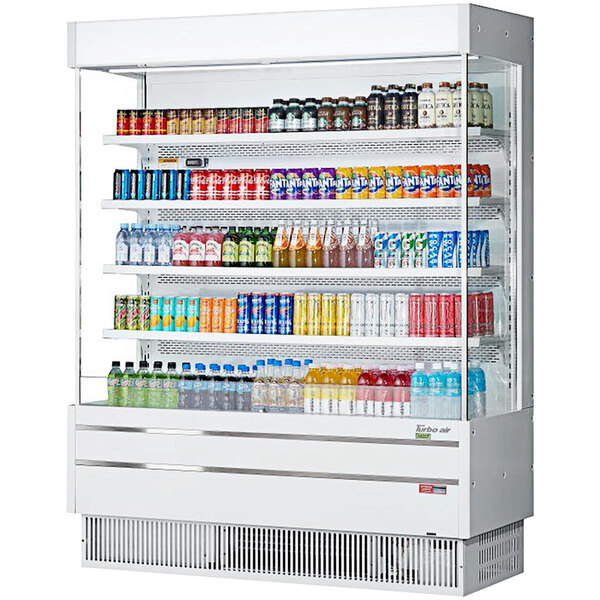 A Turbo Air white narrow depth vertical air curtain display case filled with drinks and beverages.