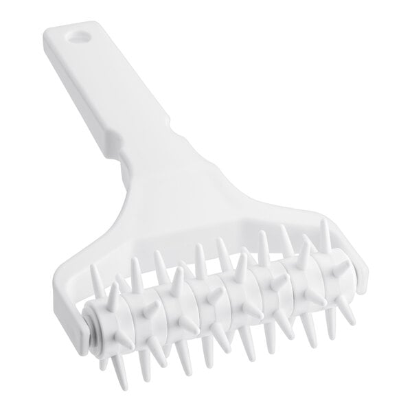 A white plastic roller with spikes.