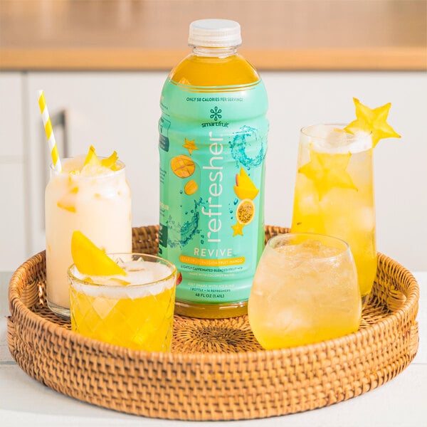 A basket with a bottle of Smartfruit Revive Star Fruit, Passion Fruit, Mango Refresher Beverage on it.