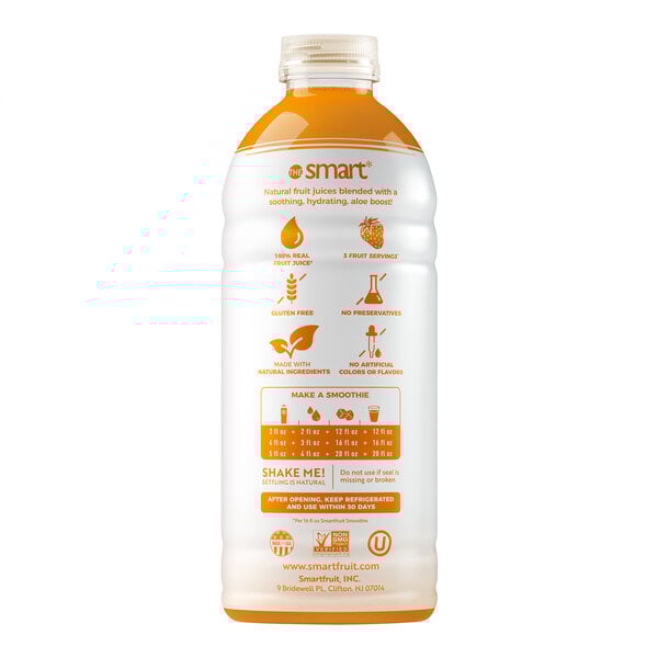 A white plastic bottle of Smartfruit Tropical Harmony Puree with orange liquid and orange text.