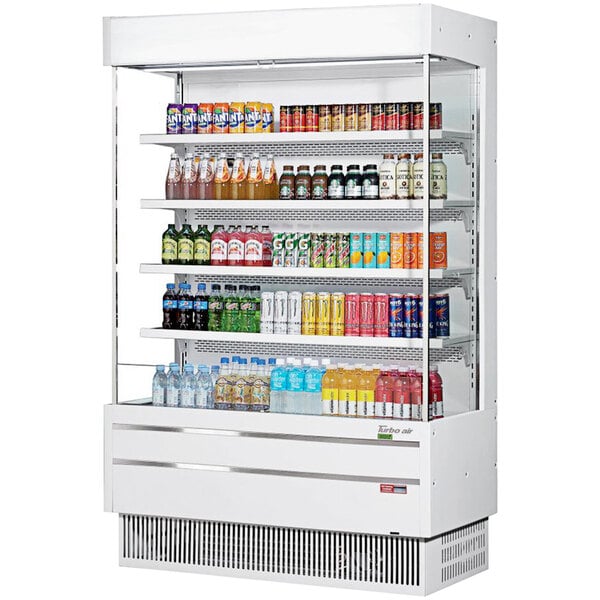 A white Turbo Air narrow depth vertical air curtain display case filled with drinks and beverages.