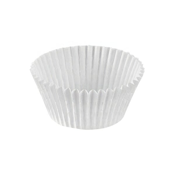 A close up of a white Novacart fluted baking cup.