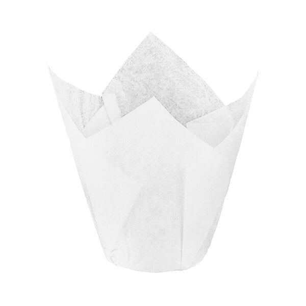 A close-up of a white paper Novacart tulip baking cup with a tulip shaped top.