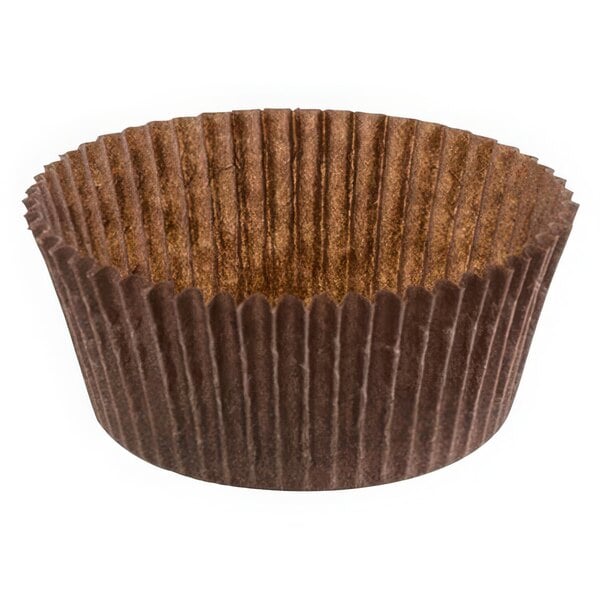 A brown paper cupcake wrapper with fluted edges.