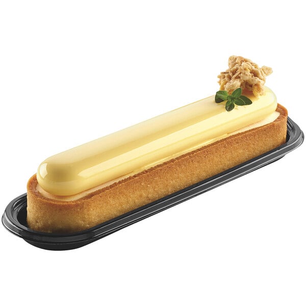 A Silikomart oblong pastry with a yellow frosting.