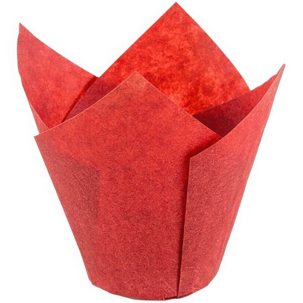 A close-up of a red paper wrapper with a folded top.