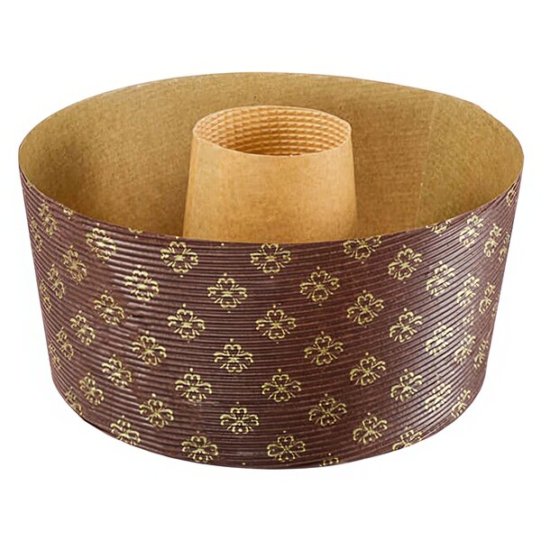 A brown and gold circular paper baking mold with a cylindrical object inside.