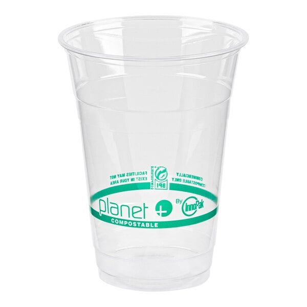 A clear plastic cup with a green logo.