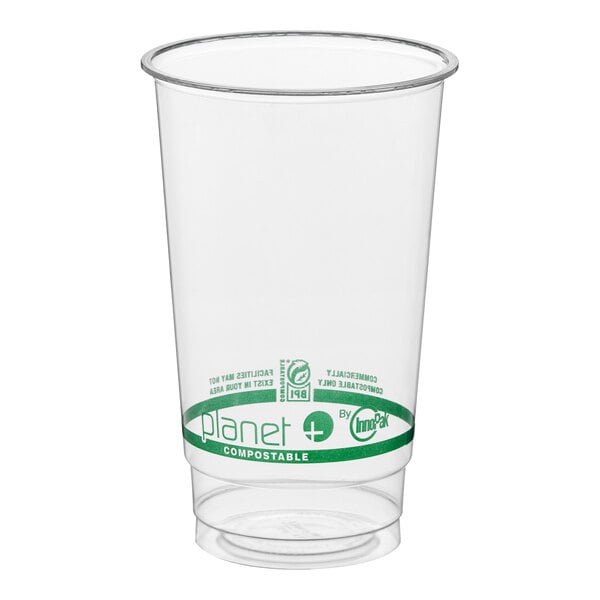 A clear 24 oz. compostable plastic cold cup with green labeling.