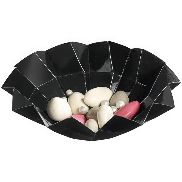 A Solia black cardboard origami bowl filled with white and pink pebbles.