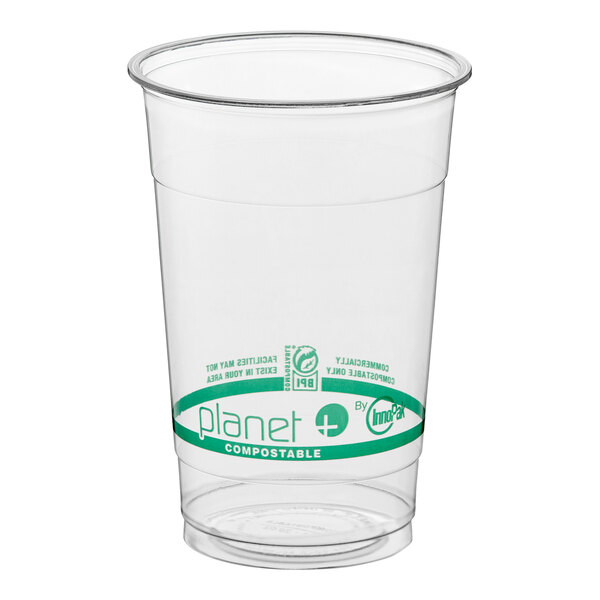 A clear 20 oz. compostable plastic cold cup with green labeling.
