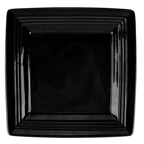 A black square Tuxton Concentrix china plate with a white background.