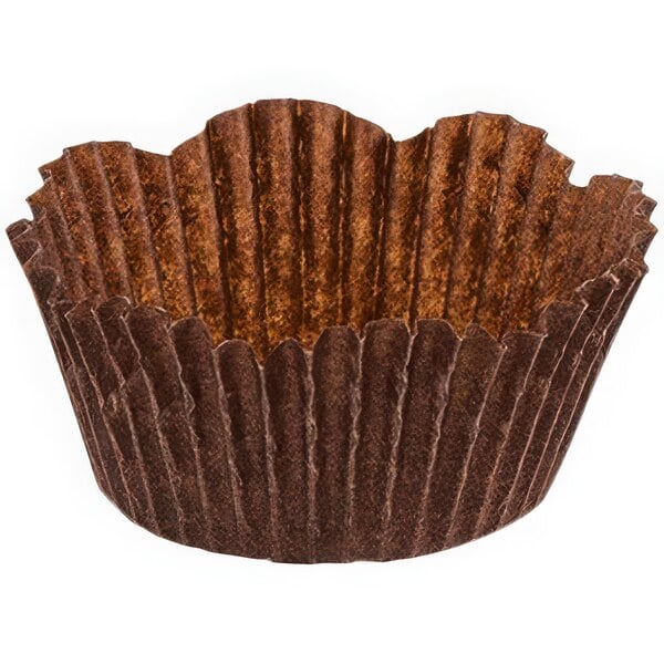 A brown paper cupcake liner with a ruffled edge.