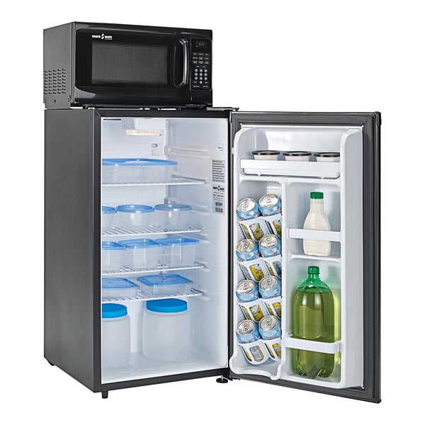 A black Danby reach-in refrigerator with its door open and drinks inside.