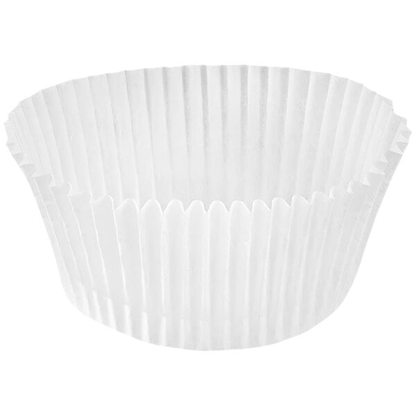 A close up of a white Novacart fluted baking cup.