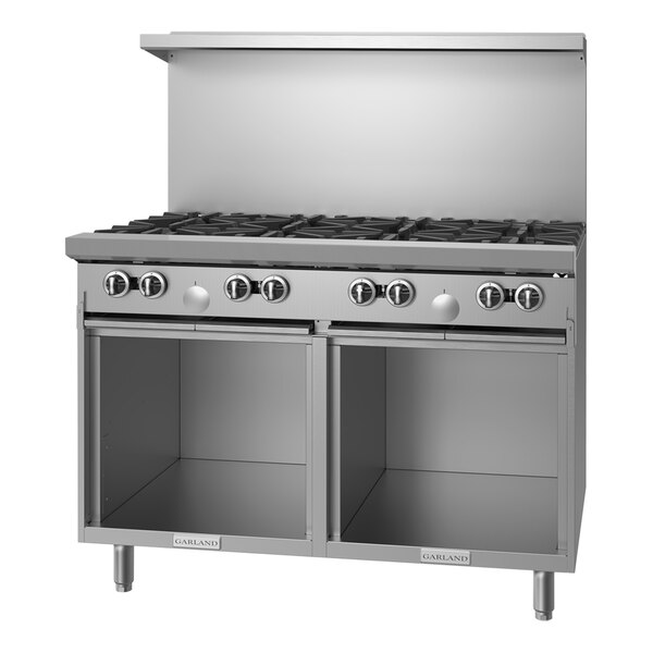 A stainless steel Garland commercial gas range with 4 burners, a griddle, and a storage base.