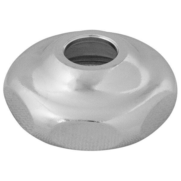 A silver circular cap nut with a hole in the center.