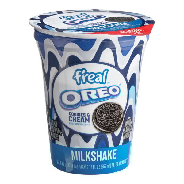 A container of f'real Oreo milkshake with a white lid.