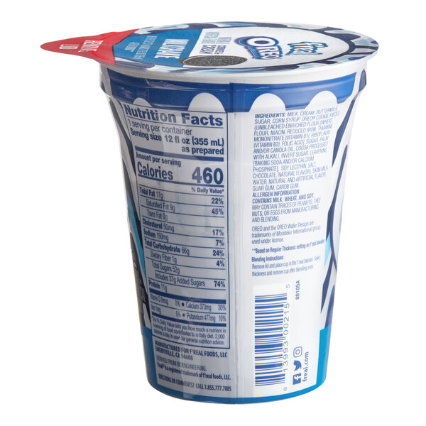 A container of f'real Oreo Cookies and Cream Milkshake with a label.