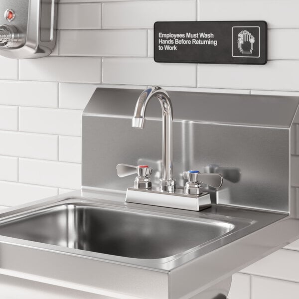 A stainless steel sink with a 3 1/2 inch long gooseneck spout and dual-handle faucet.